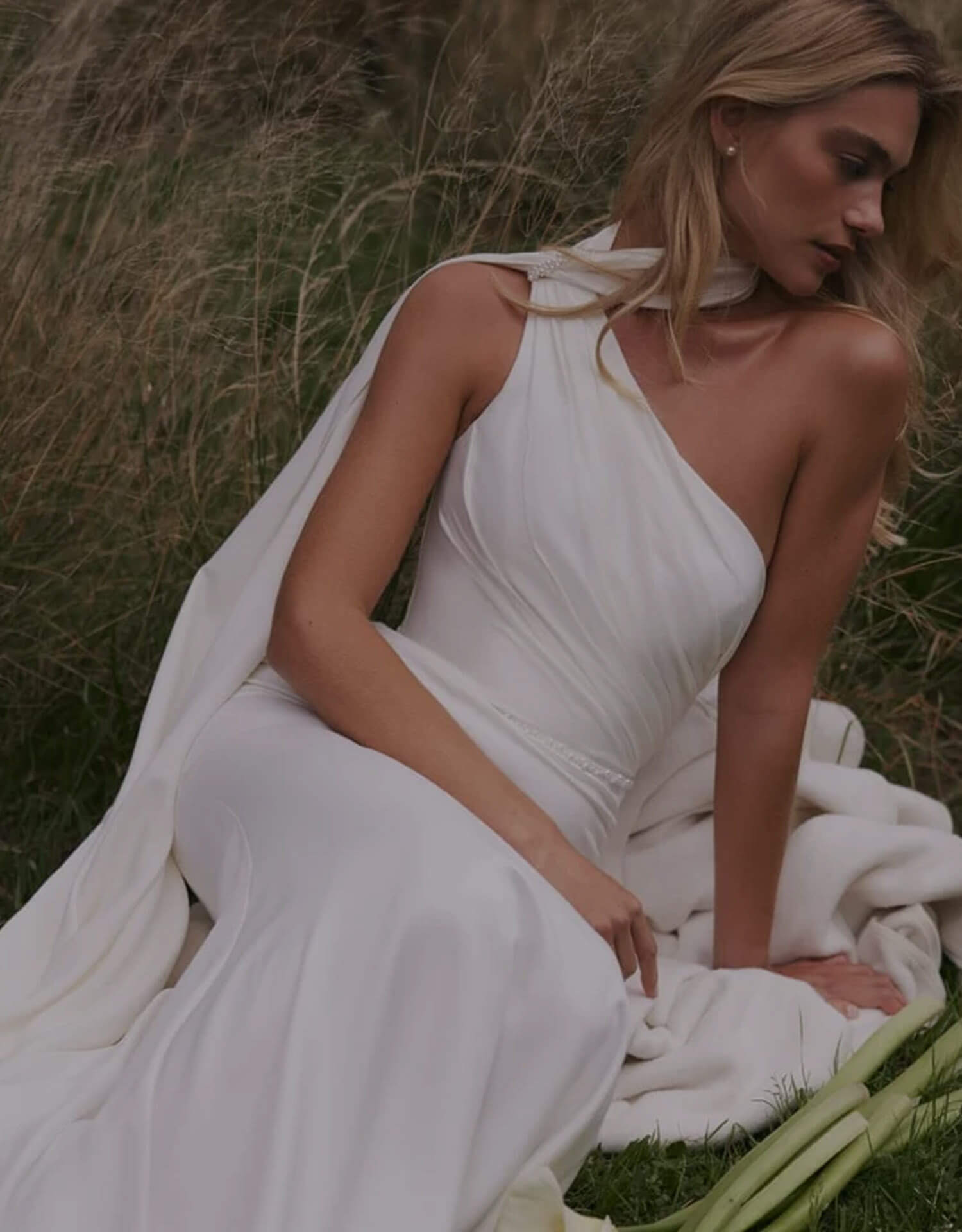 Model wearing a white gown - Mobile Image