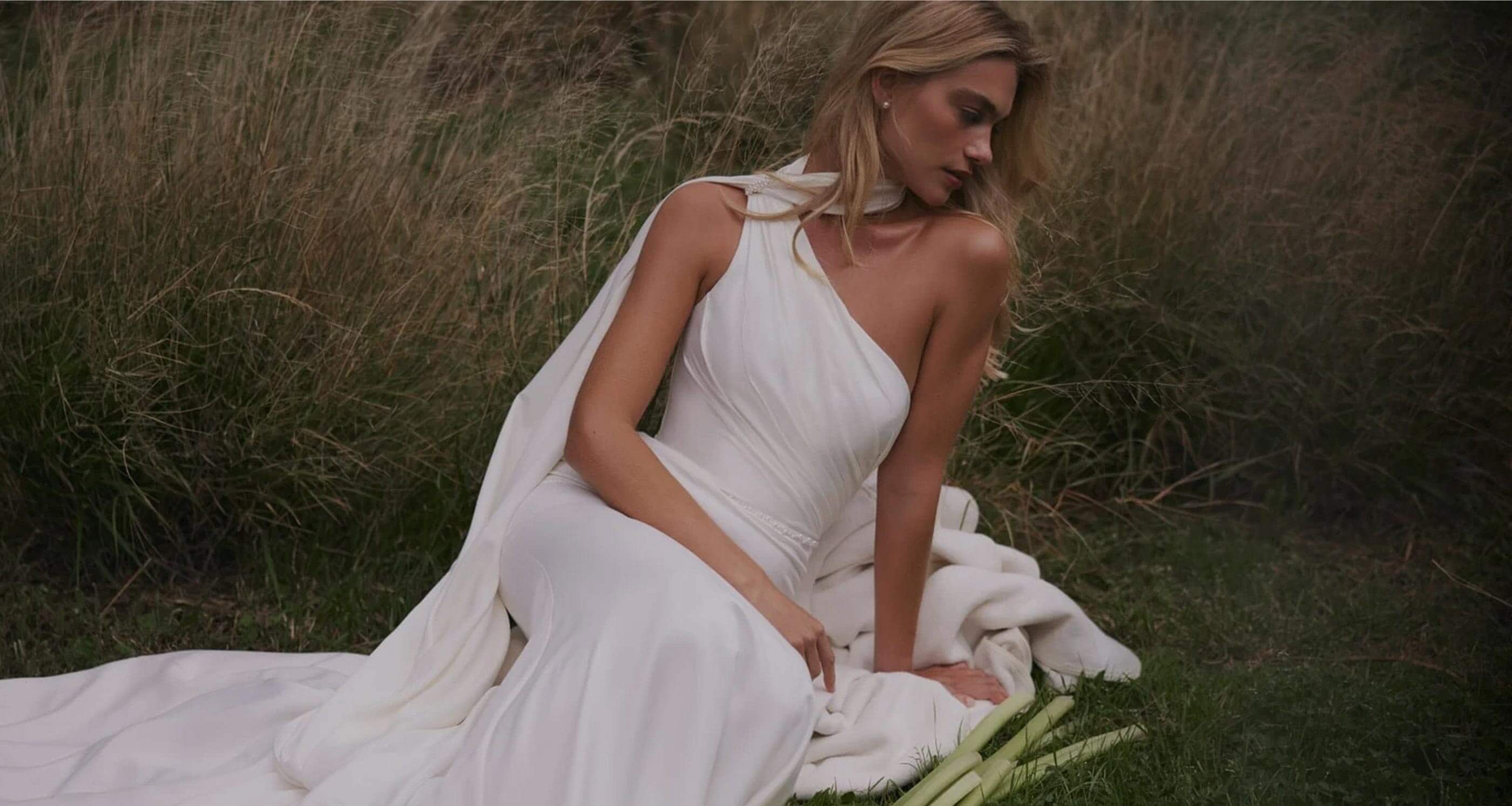 Model wearing a white gown - Desktop Image